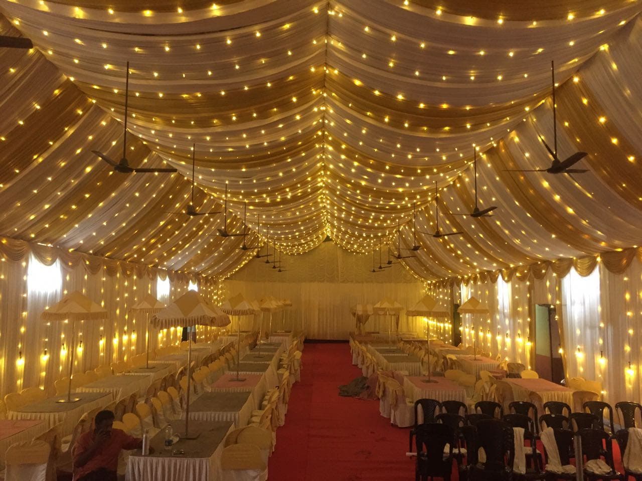About Red Q Events Elegant fairy-light wedding canopy created by Red Q Events in Kerala
